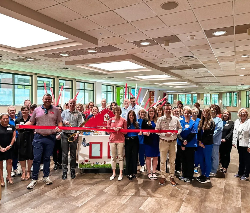 Group gathered for a Care Cart ribbon-cutting celebration.