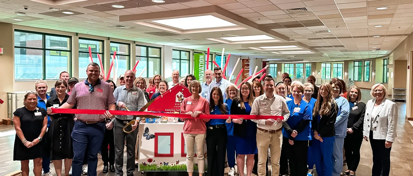 Group gathered for a Care Cart ribbon-cutting celebration.