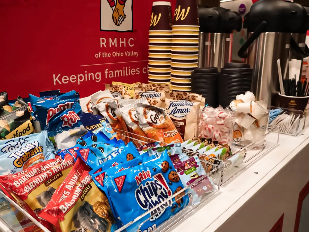 Packaged snacks and beverage supplies stocked on a Care Cart.