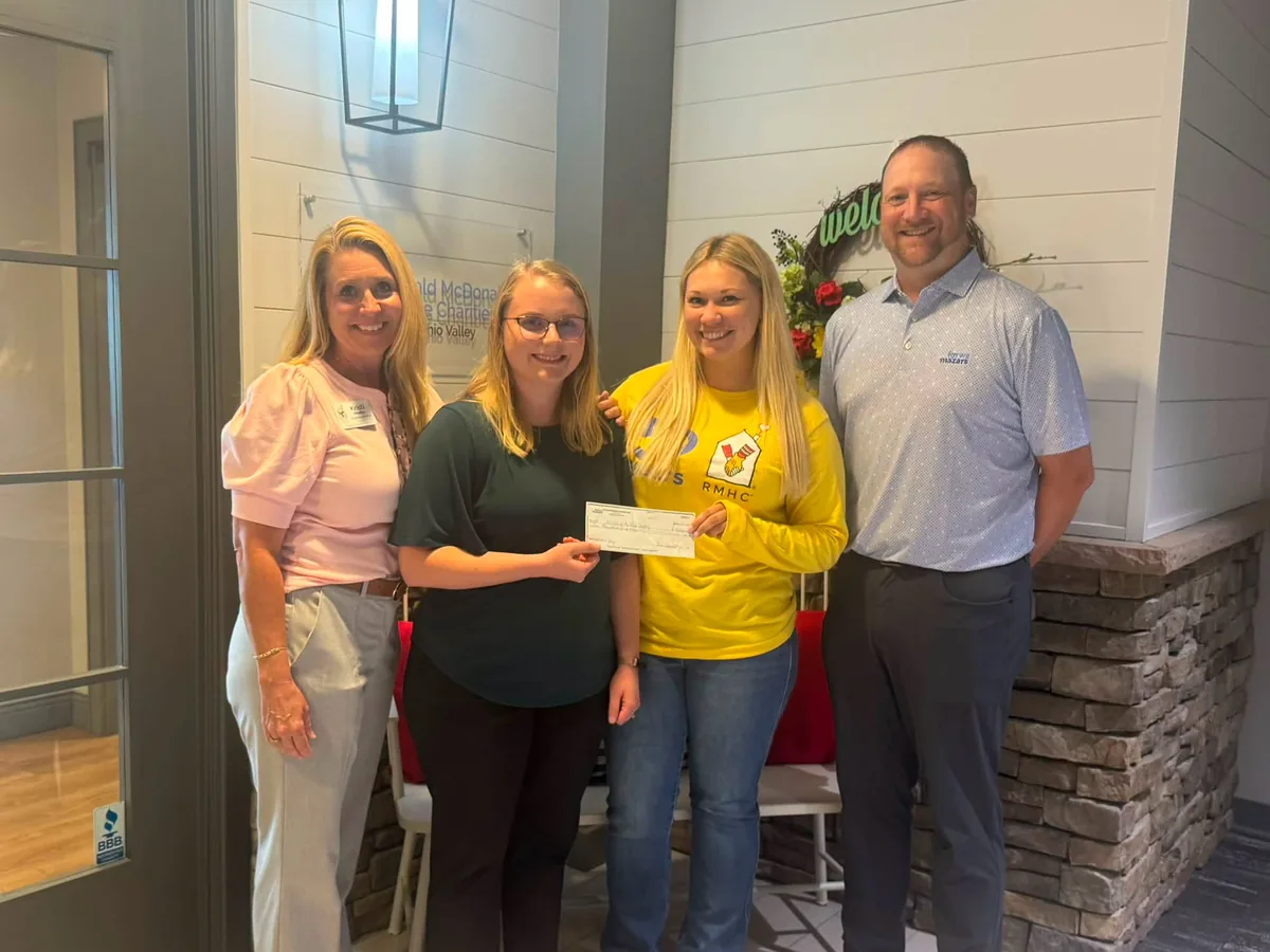 Annual partners presenting a check to Ronald McDonald House staff.