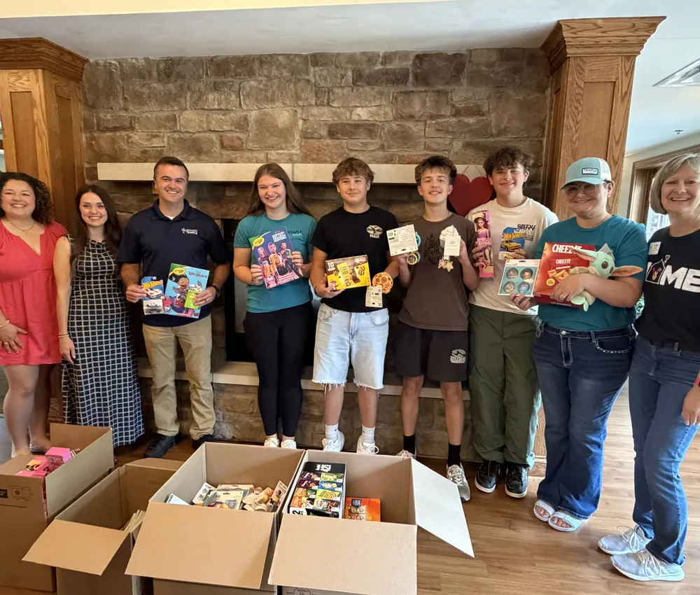 Methodist Temple volunteers with donated toys at Ronald McDonald House.
