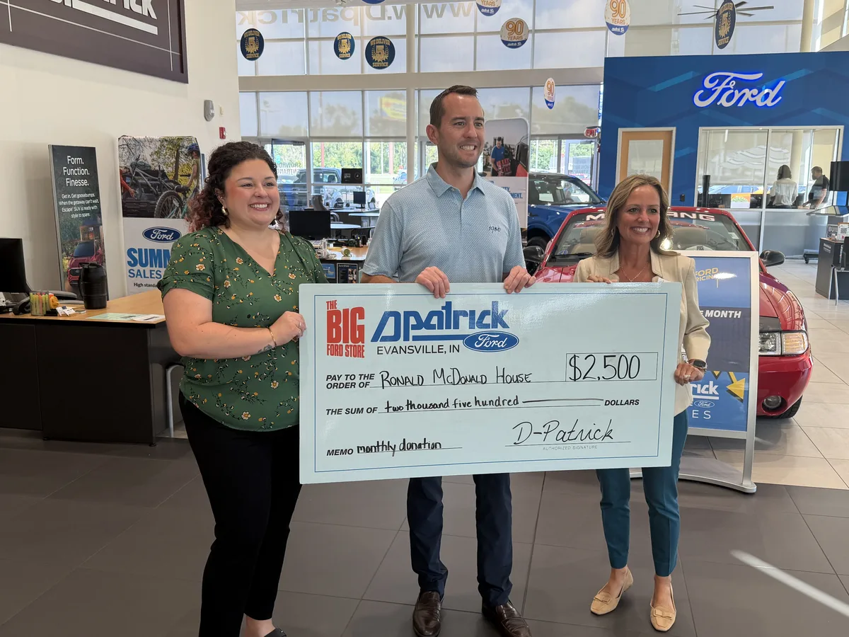 Community partners presenting a donation to Ronald McDonald House.