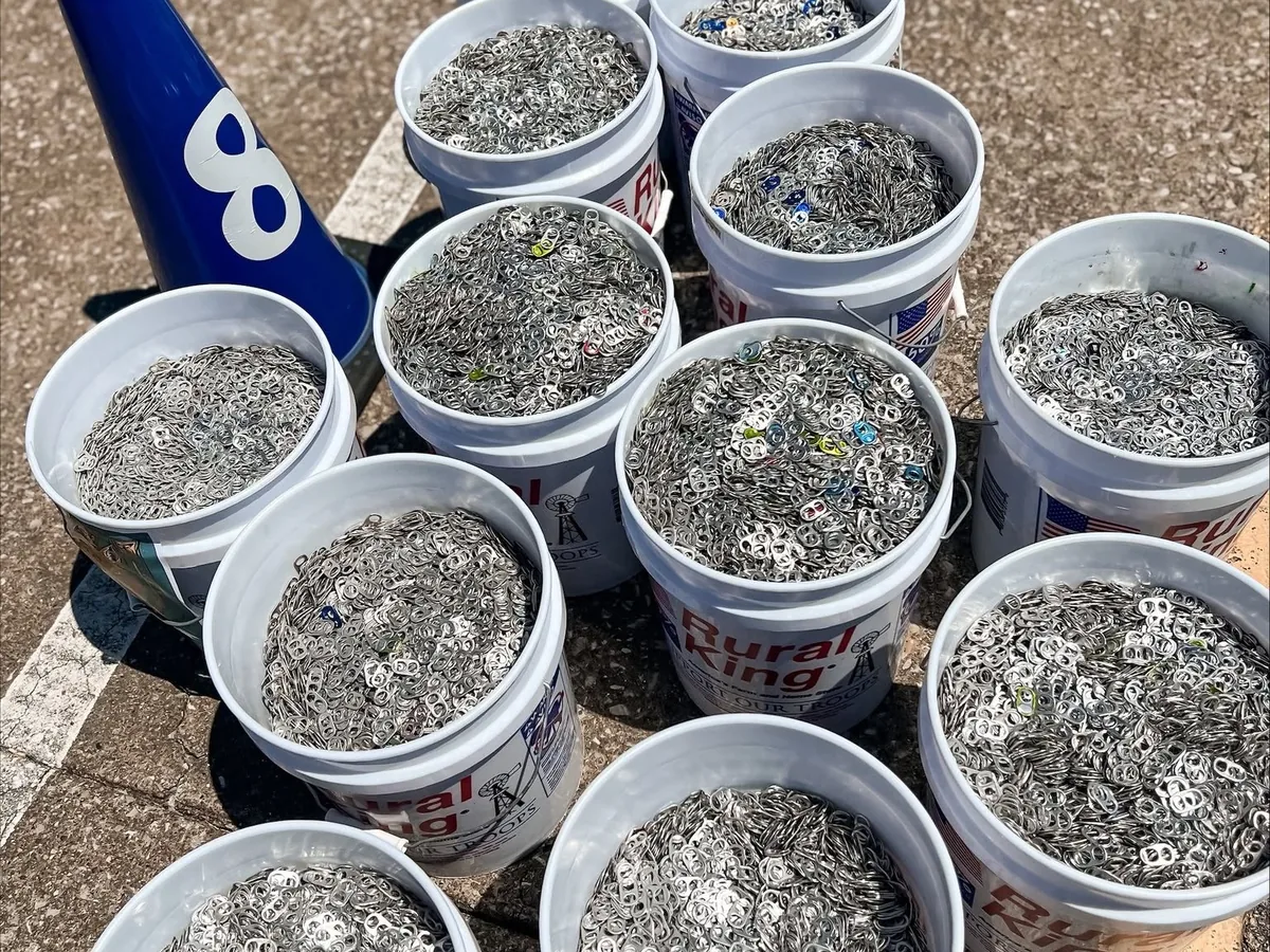 Buckets filled with collected pop tabs.