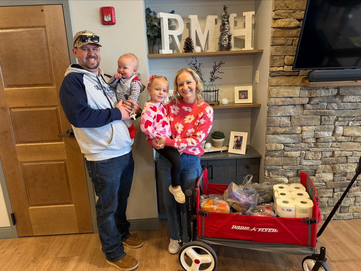 A family delivering a wagon of donated supplies to the House.