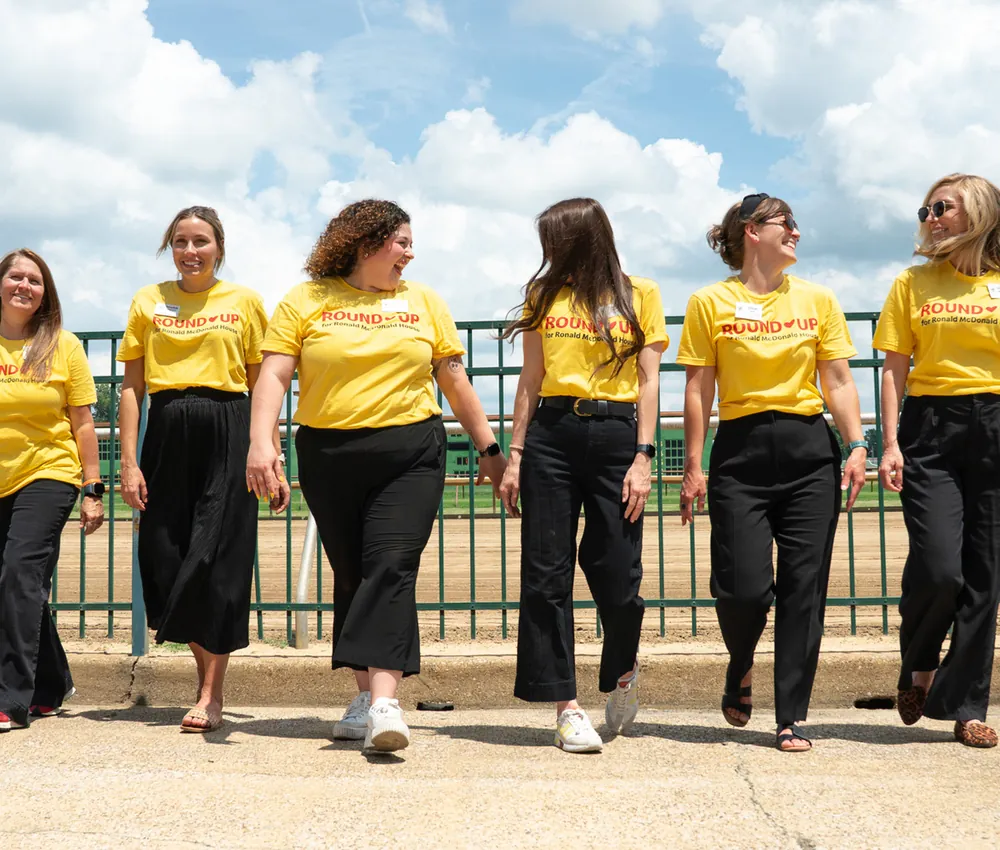 Ronald McDonald House Ohio Valley staff members walking together in matching yellow shirts.