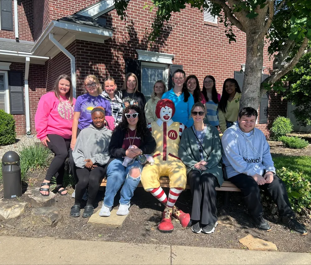 FCCLA student volunteers gathered with Ronald McDonald outside the House.