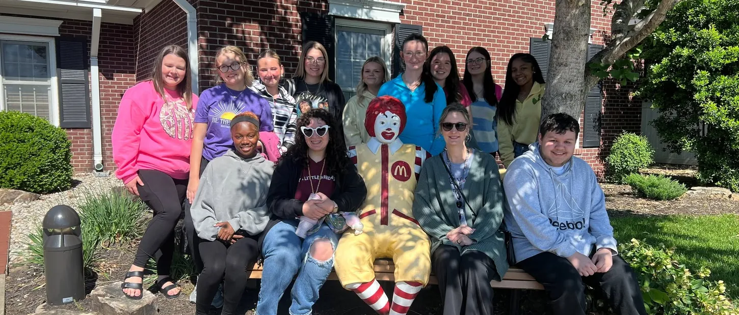 FCCLA student volunteers gathered with Ronald McDonald outside the House.