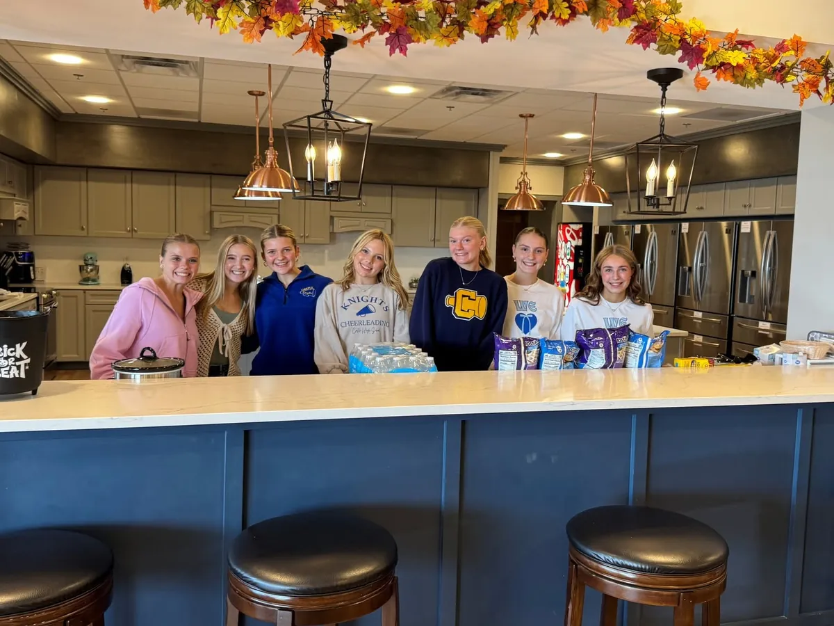 Students preparing a meal together in the House kitchen.