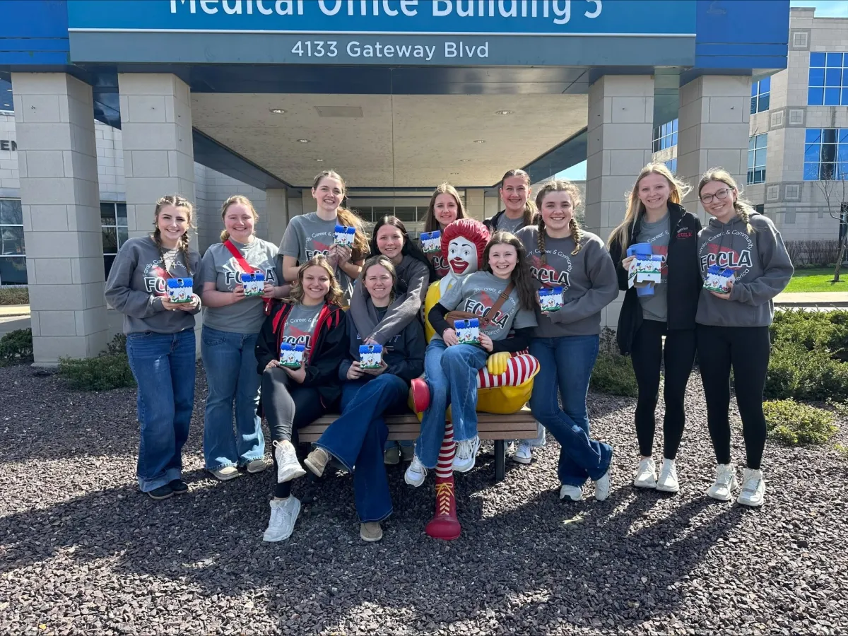 FCCLA student volunteers with Ronald McDonald outside Medical Office Building 5 at Deaconess Gateway.