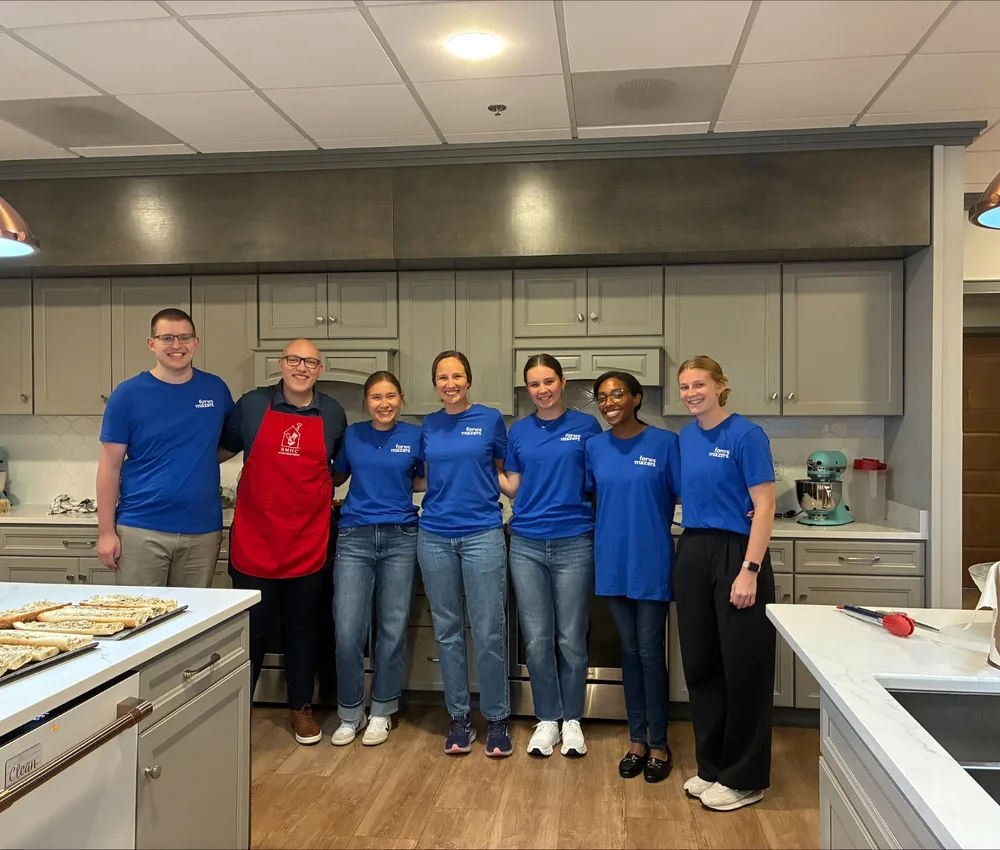 Forvis volunteers gathered in a Ronald McDonald House kitchen.