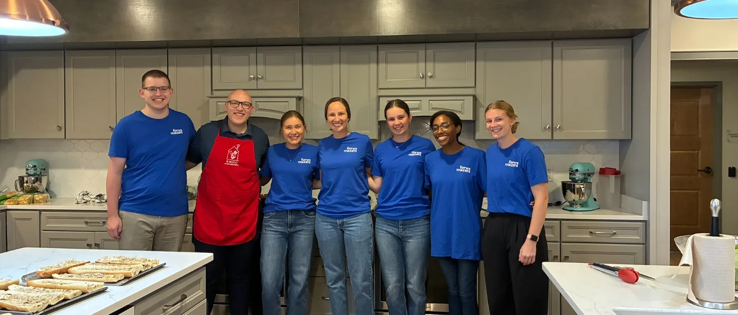 Forvis volunteers gathered in a Ronald McDonald House kitchen.